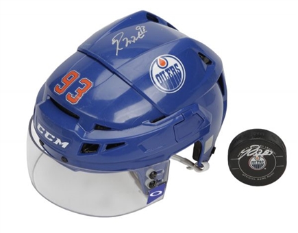 2012-13 Ryan Nugent-Hopkins Game Used and Signed Edmonton Oilers Helmet w/ Signed Puck From 1st Career Game